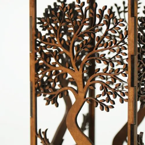 Close-up of the layered tree detail on the wooden candle holder