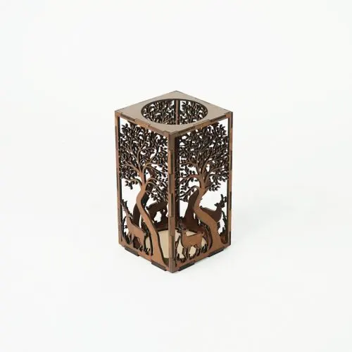 Laser-cut wooden candle holder with a forest and deer pattern
