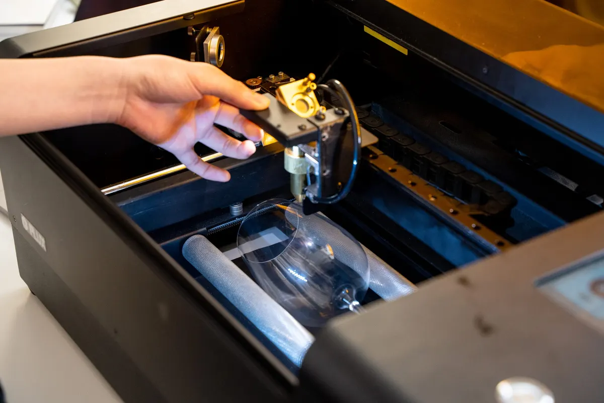 CO2 laser cutting a sheet inside an enclosed FLUX laser cutter