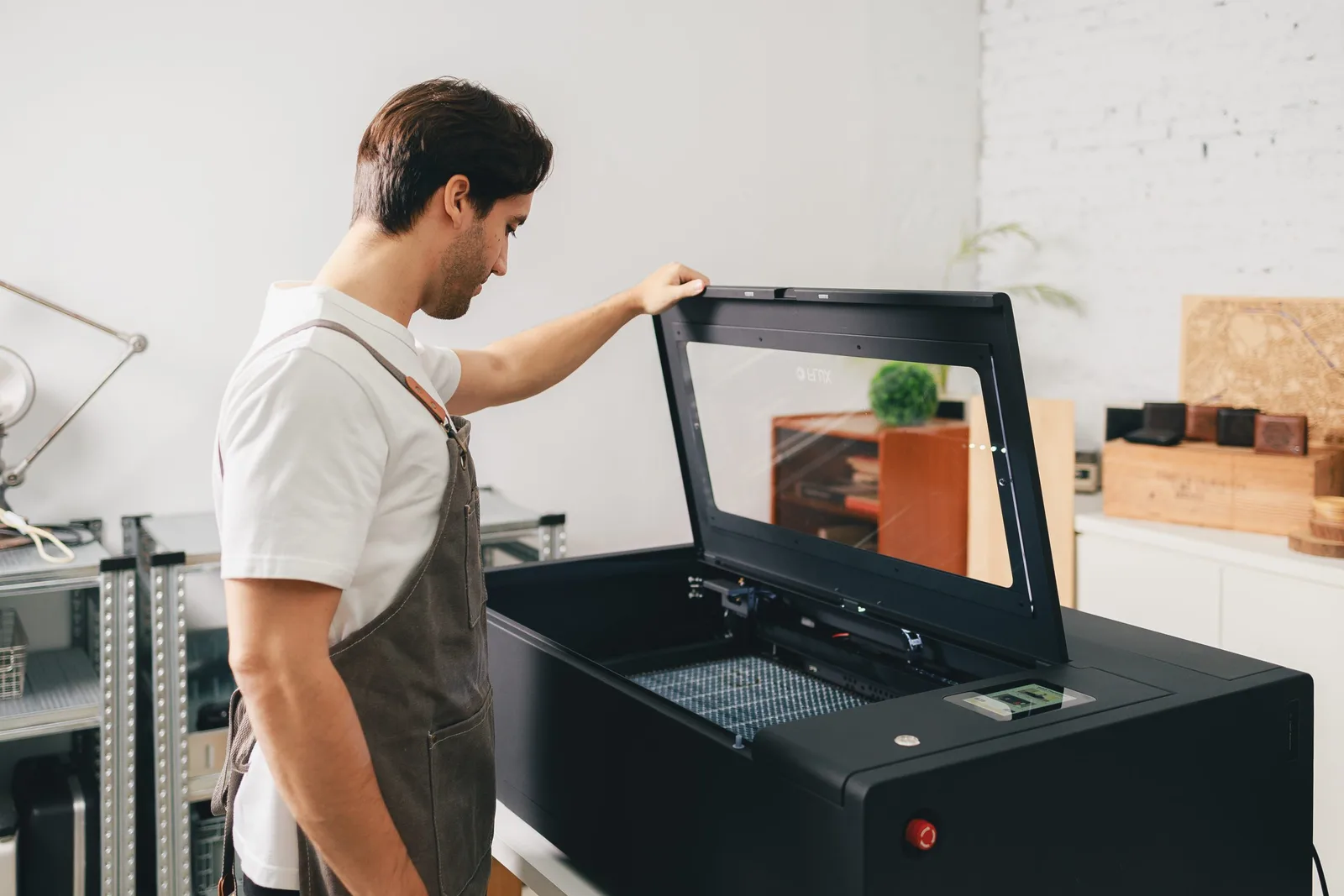 FLUX laser cutter in a bright workshop