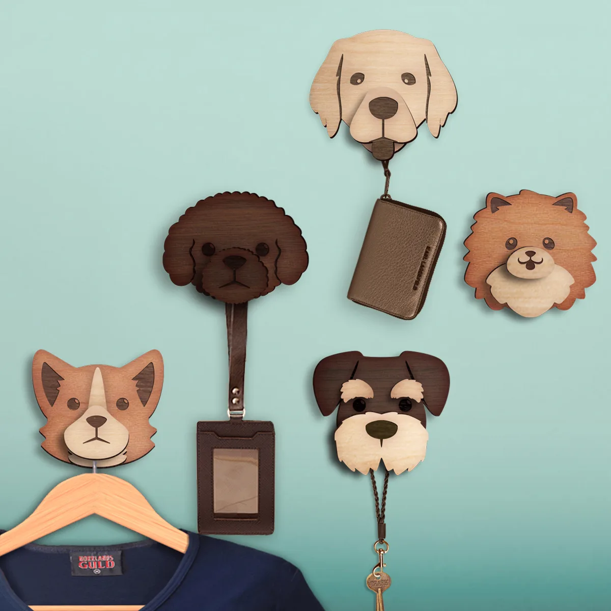 A collection of wooden dog-shaped hooks by Mr. Sheep