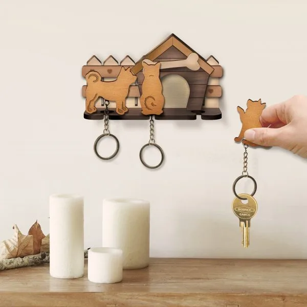 A dog-house-shaped wooden key holder
