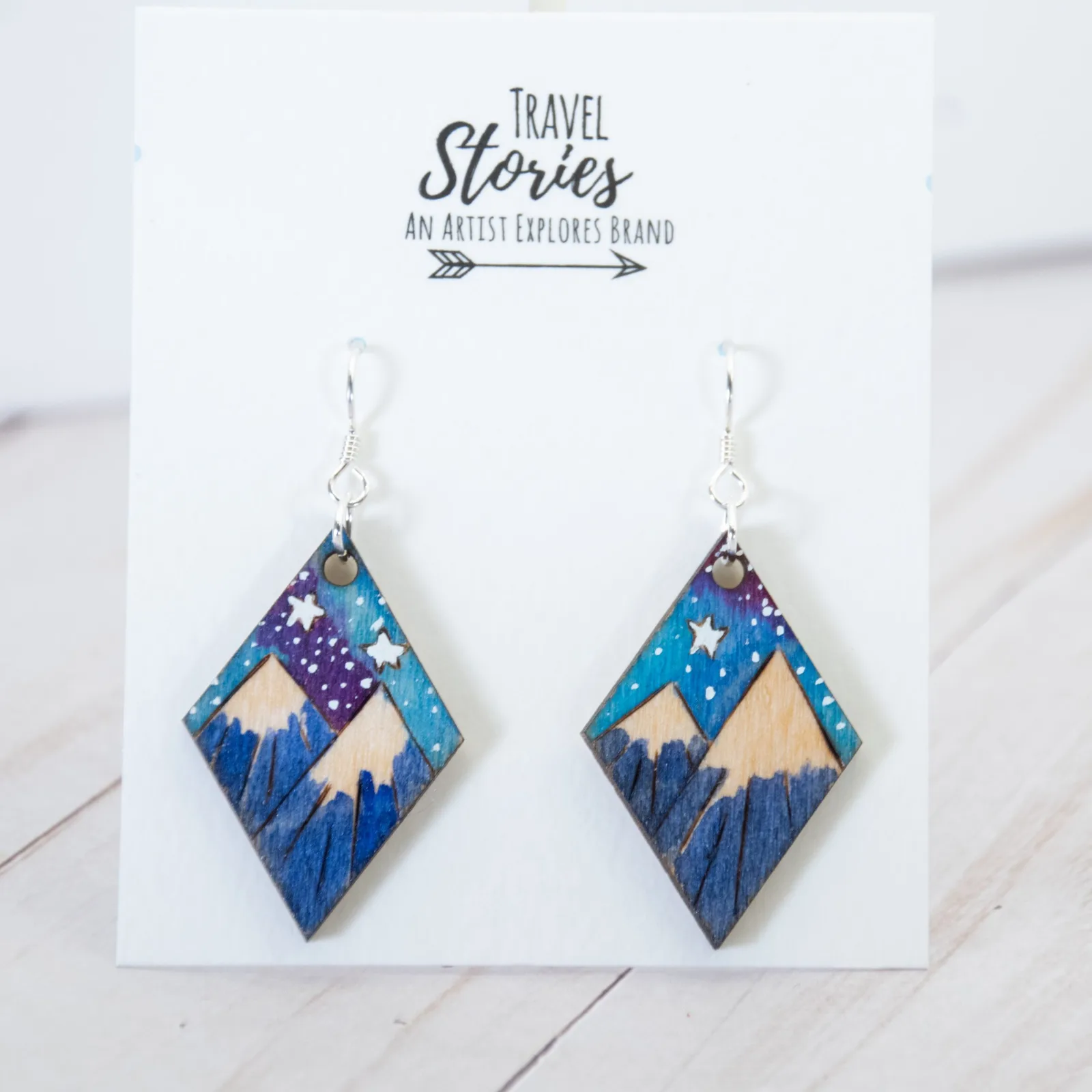 Hand-painted wooden mountain earrings inspired by travel