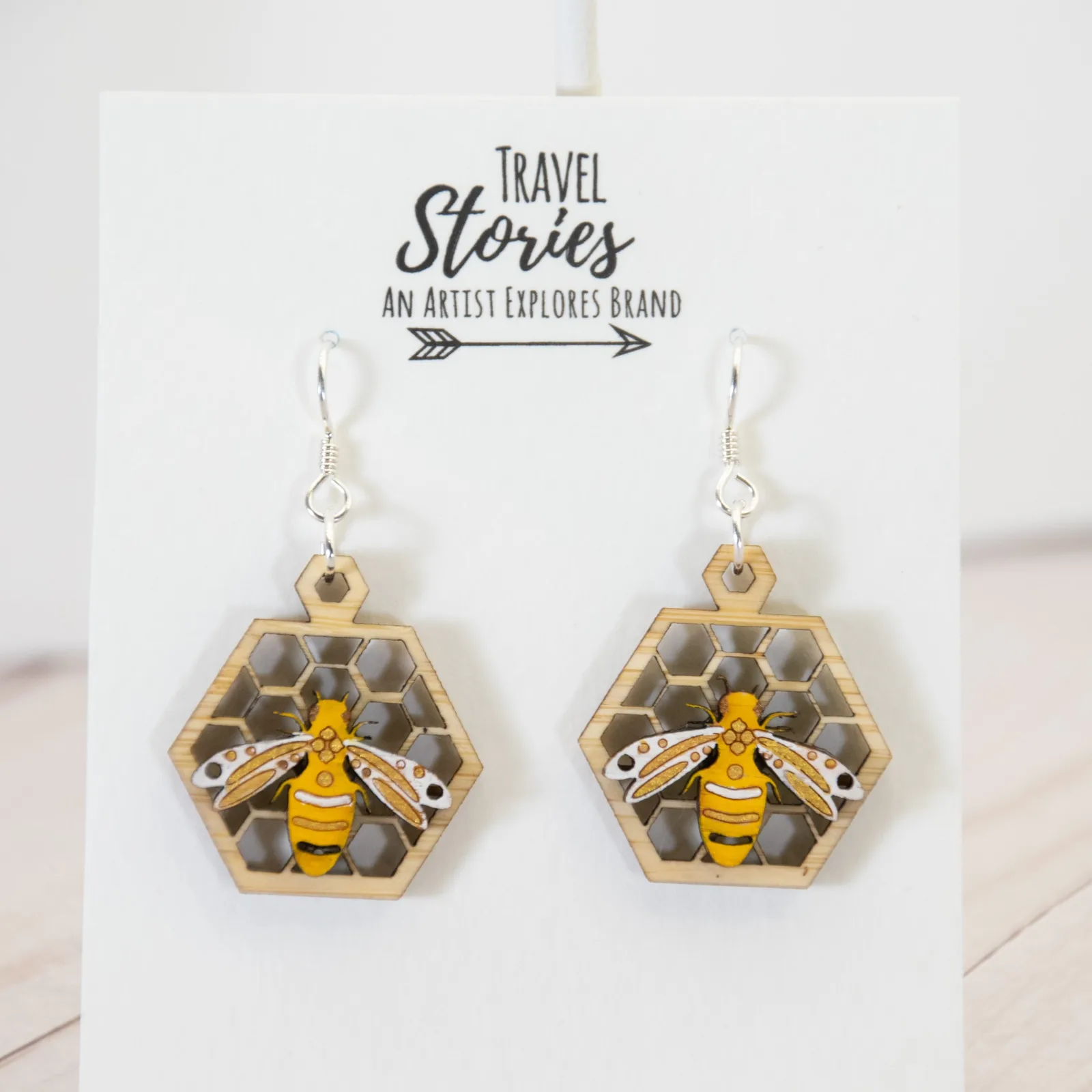Layered laser-cut bee earrings by Natasha Stoppel