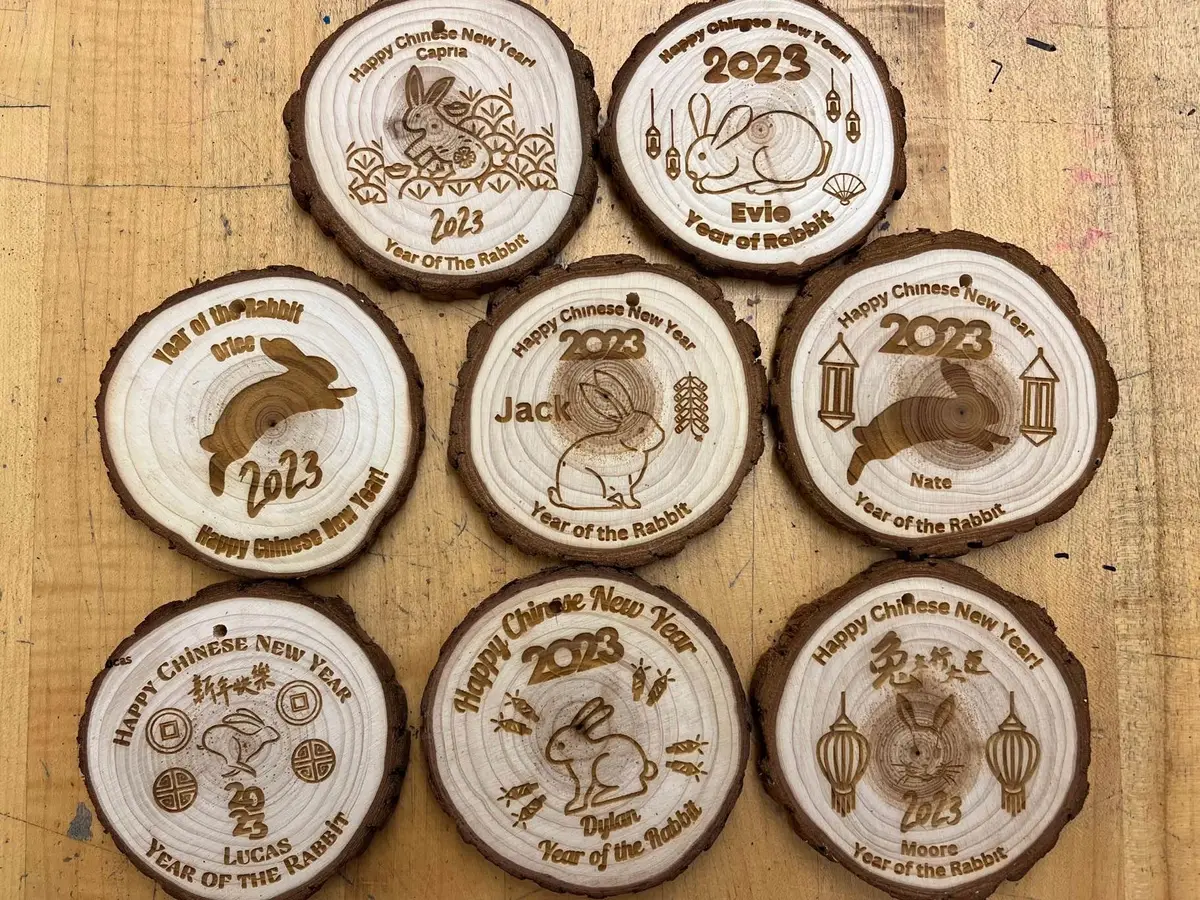Laser-engraved Lunar New Year ornaments made by students