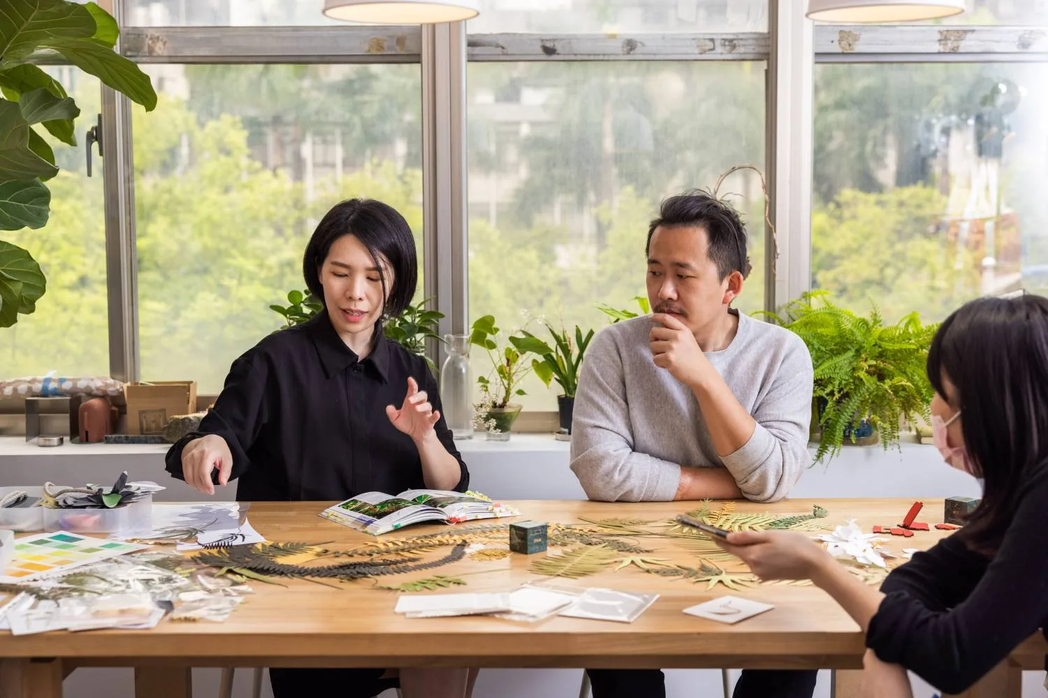Paper-cut artist Wuba Yang working with detailed paper forms