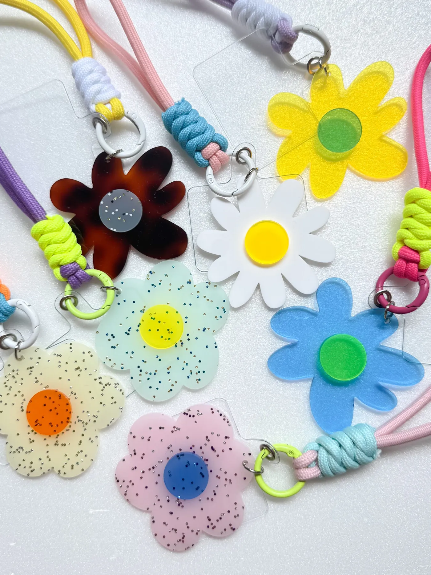 Colorful flower-shaped acrylic phone straps by PONTRE STUDIO