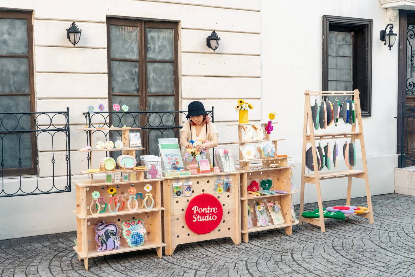 Mika Matsumoto presenting PONTRE STUDIO products at an outdoor market