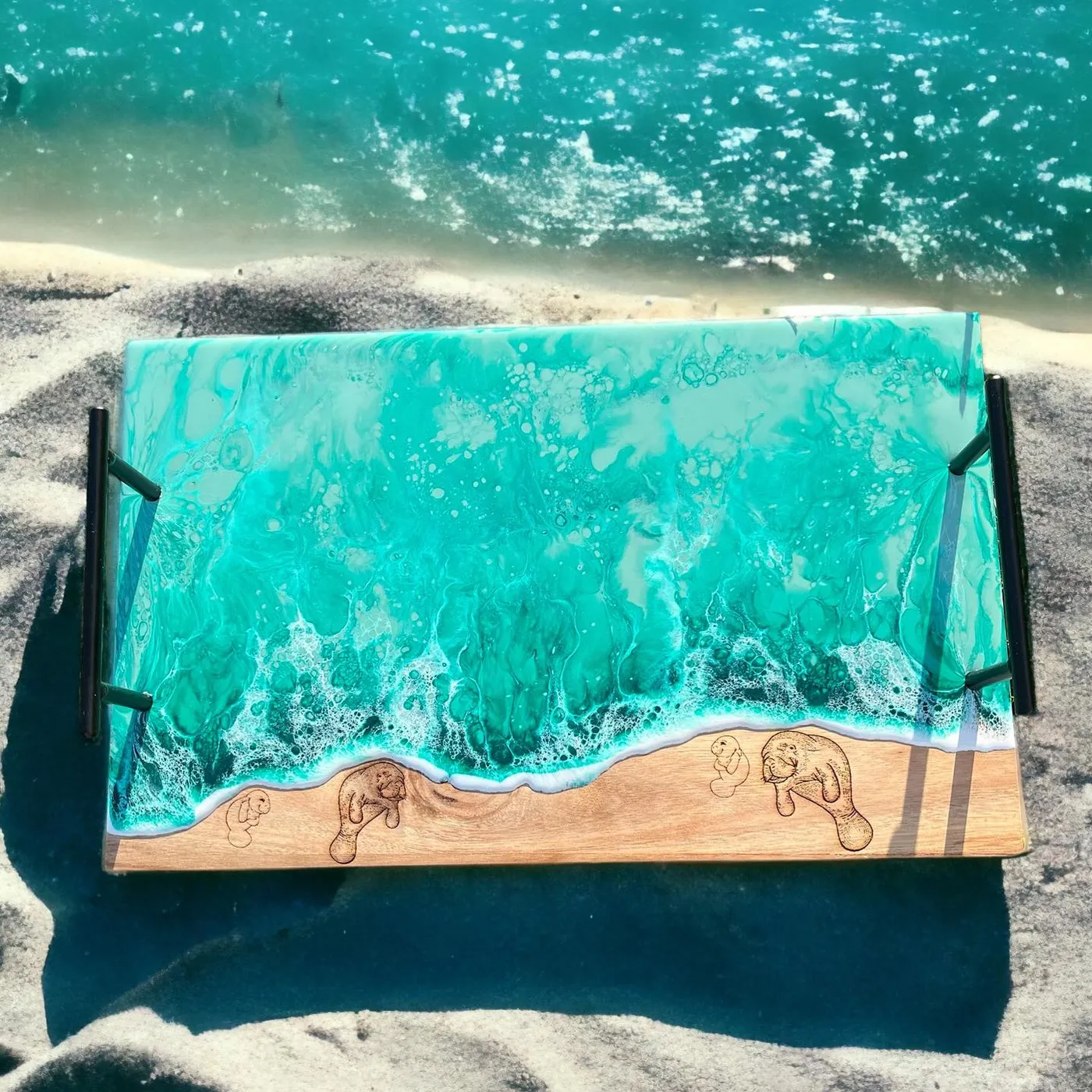 A finished ocean resin artwork made on an engraved wooden panel