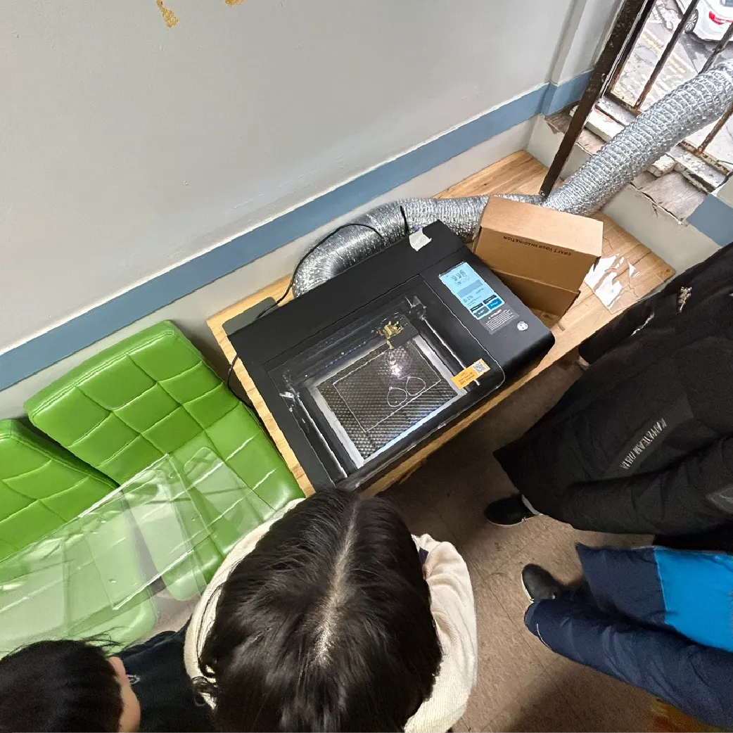 A beamo laser cutter processing waste acrylic for a STEAM lesson