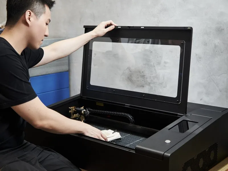 Tony Chen working with a Beambox Pro laser cutter