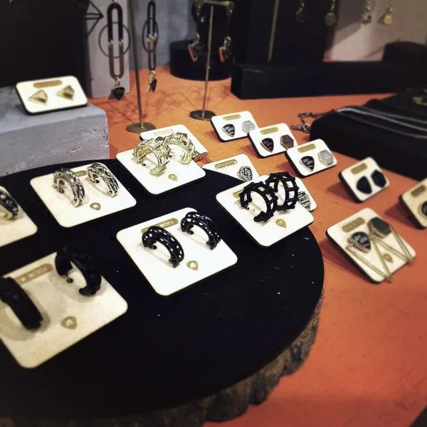 Rock-inspired New Noise earrings displayed in the shop